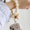 Weiße Handyhülle mit kleinem Blumen-Lanyard